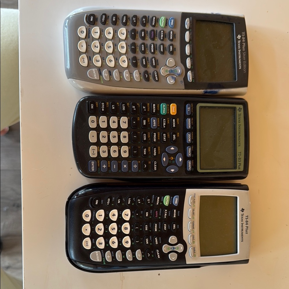 Texas Instruments Black and Silver Calculators Trio